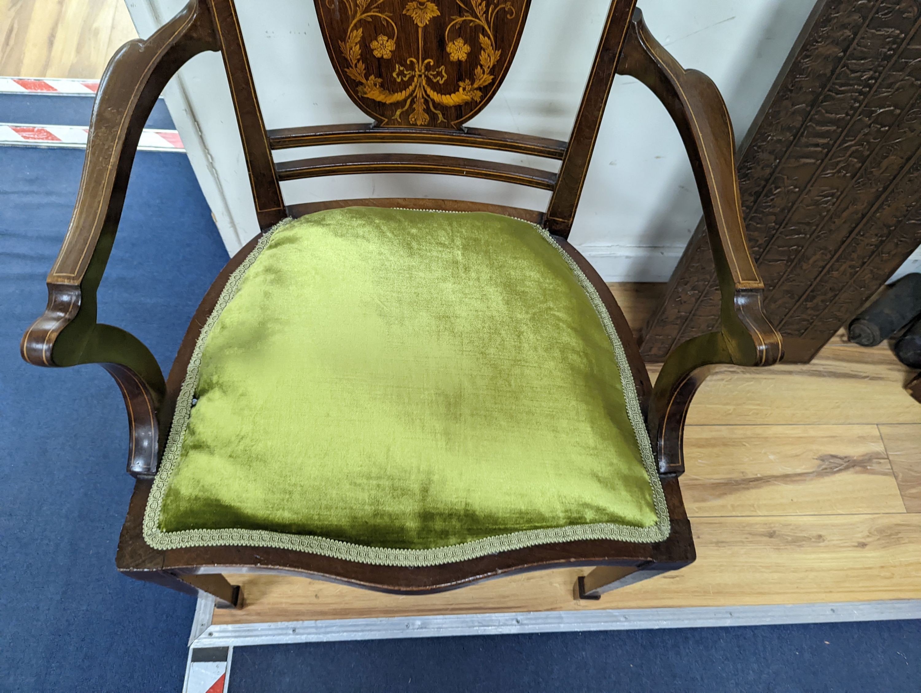 An Edwardian marquetry inlaid mahogany elbow chair